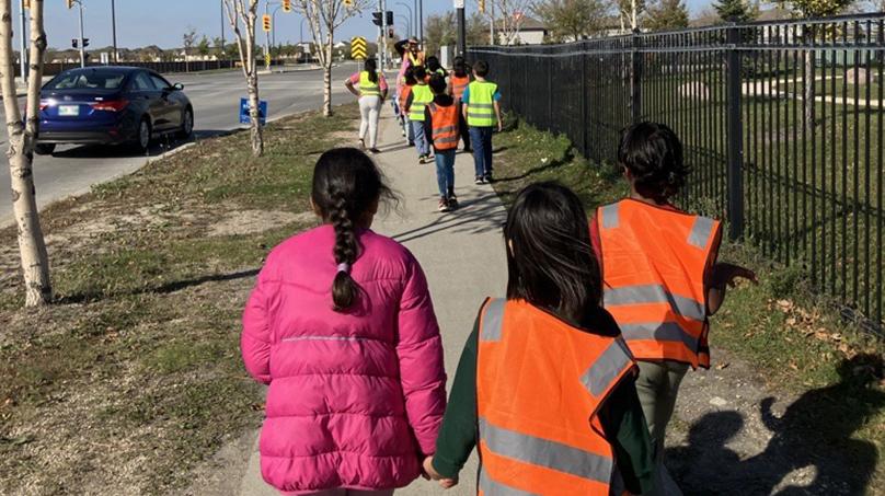 Students learn how to navigate streets, crosswalks, and intersections safely.