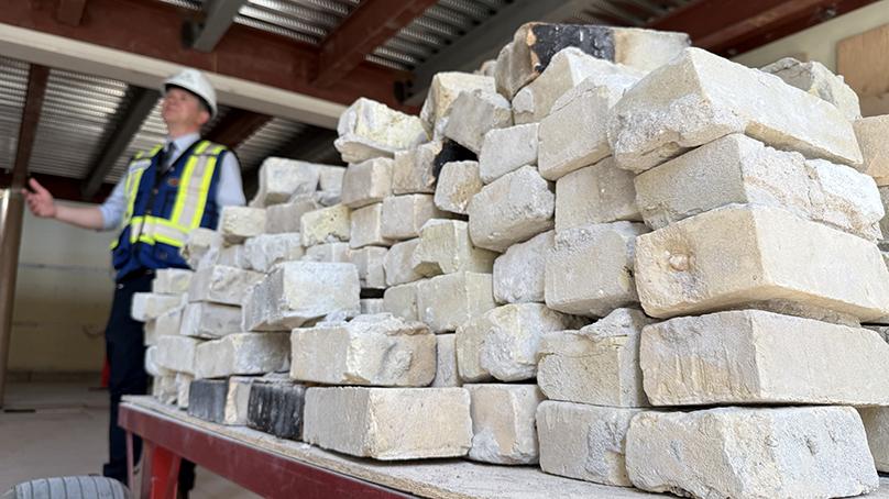 One by one, brick walls have been taken apart and the bricks safely stored to be used again inside.