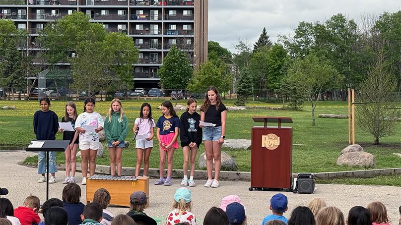 Students perform a poem at an Arbor Day ceremony at Royal School.