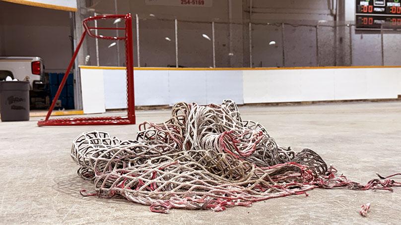 Hockey nets are repainted ahead of the season.