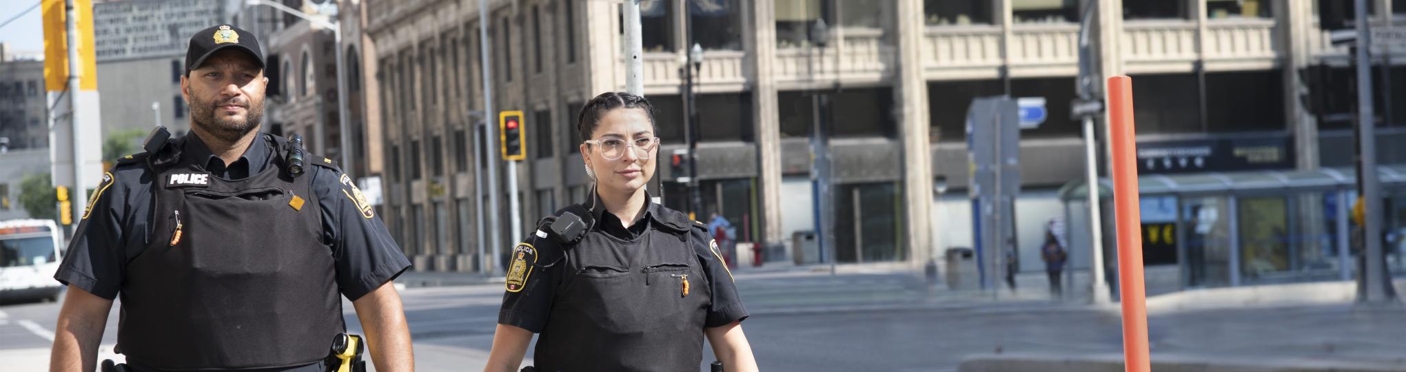 Two police officers on the street in Winnipeg